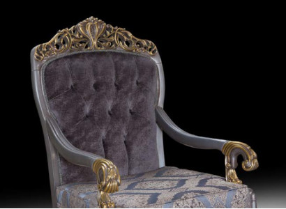 Elegant classic armchair with decorative patterns in Chesterfield design.